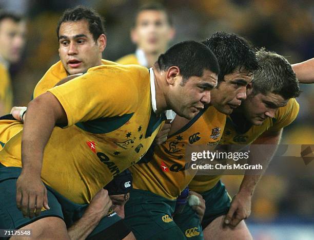 The Australian Wallabies front row of Rodney Blake, Tai McIsaac and Greg Holmes prepare for a scrum during the Cook Cup match between Australian...