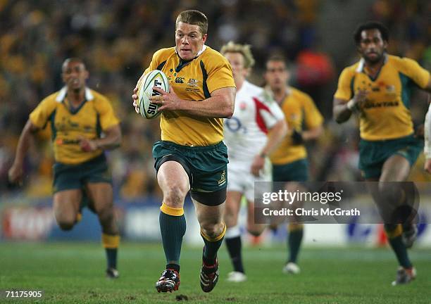 Clyde Rathbone of the Wallabies makes a break during the Cook Cup match between Australian Wallabies and England at Telstra Stadium on June 11, 2006...