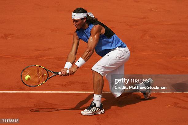 Rafael Nadal of Spain in action against Roger Federer of Switzerland during the Men?s Singles Final on day fifteen of the French Open at Roland...