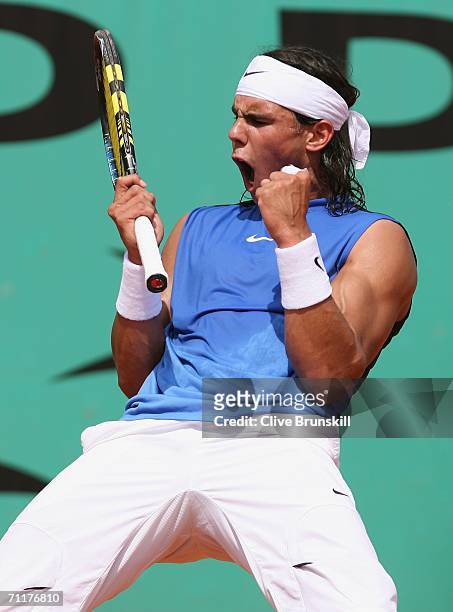 Rafael Nadal of Spain celebrates a point against Roger Federer of Switzerland during the Men's Singles Final on day fifteen of the French Open at...