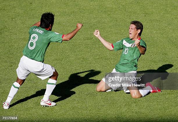 Pavel Pardo and Guillermo Franco of Mexico celebrate after teammate Omar Bravo scores the opening goal during the FIFA World Cup Germany 2006 Group D...