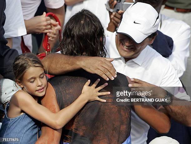 Spain's Rafael Nada is congratulated by his coach and uncle Tony after winning the French tennis Open final against Swiss Roger Federer at Roland...