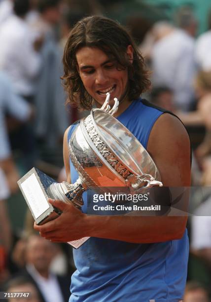 Rafael Nadal of Spain holds the trophy after defeating Roger Federer of Switzerland during the Men's Singles Final on day fifteen of the French Open...