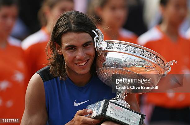 Rafael Nadal of Spain holds the trophy after defeating Roger Federer of Switzerland during the Men's Singles Final on day fifteen of the French Open...