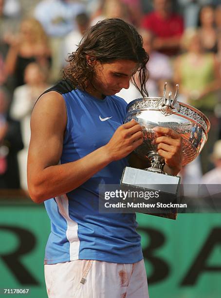 Rafael Nadal of Spain holds the trophy after defeating Roger Federer of Switzerland during the Men's Singles Final on day fifteen of the French Open...