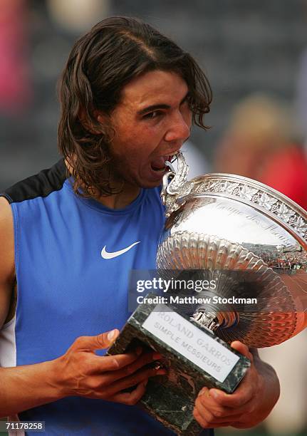 Rafael Nadal of Spain holds the trophy after defeating Roger Federer of Switzerland during the Men's Singles Final on day fifteen of the French Open...