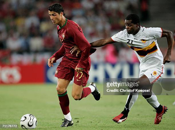 Cristiano Ronaldo of Portugal chases the ball after getting past Luis Delgado of Angola during the FIFA World Cup Germany 2006 Group D match between...