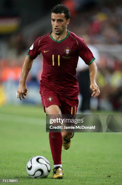 Sabrosa Simao of Portugal runs with the ball during the FIFA World Cup Germany 2006 Group D match between Angola and Portugal at the Stadium Koln on...