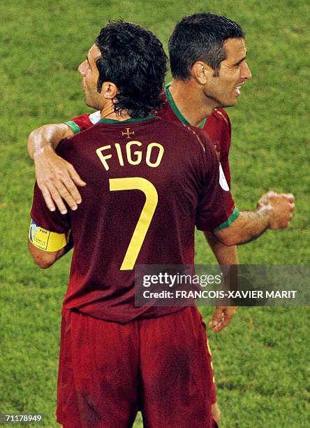 Portuguese forward Luis Figo and Portuguese forward Pauleta celebrate after winning the 2006 World Cup Group D football match Angola vs. Portugal, 11...