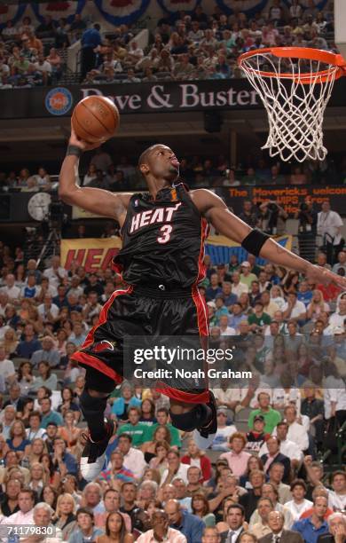 Dwyane Wade of the Miami Heat drives for a dunk attempt against the Dallas Mavericks during Game Two of the 2006 NBA Finals June 11, 2006 at American...