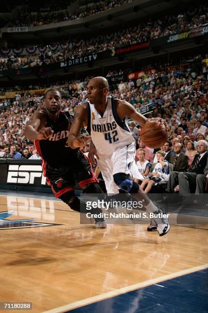 Jerry Stackhouse of the Dallas Mavericks drives against Dwyane Wade of the Miami Heat during Game Two of the 2006 NBA Finals June 11, 2006 at...