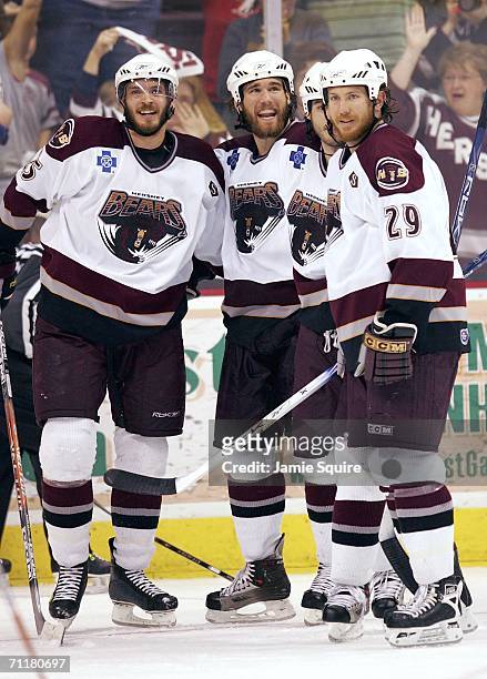 Kris Beech of the Hershey Bears celebrates with teammates, including Dean Arsene, after scoring a goal during the 2nd period of game four of the AHL...