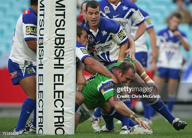 Michael Weyman of the Raiders dives over for a try during the round 14 NRL match between the Bulldogs and the Canberra Raiders played at Telstra...