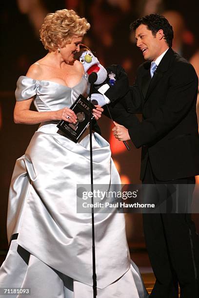 Presenters Christine Ebersole and John Tartaglia appear onstage at the 60th Annual Tony Awards at Radio City Music Hall June 11, 2006 in New York...