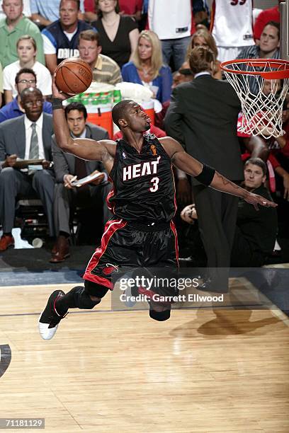 Dwyane Wade of the Miami Heat dunks against the Dallas Mavericks during Game Two of the 2006 NBA Finals on June 11, 2006 at the American Airlines...