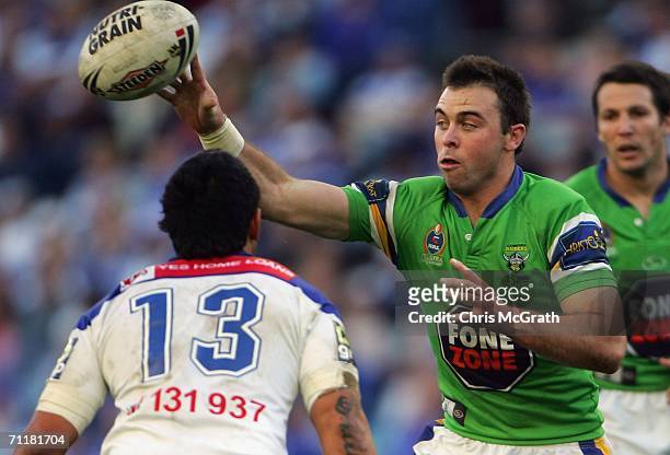 Marshall Chalk of the Raiders throws a pass during the round 14 NRL match between the Bulldogs and the Canberra Raiders played at Telstra Stadium,...