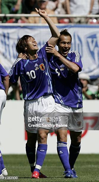 Shunsuke Nakamura of Japan celebrates with teammate Naohiro Takahara after scoring the opening goal during the FIFA World Cup Germany 2006 Group F...