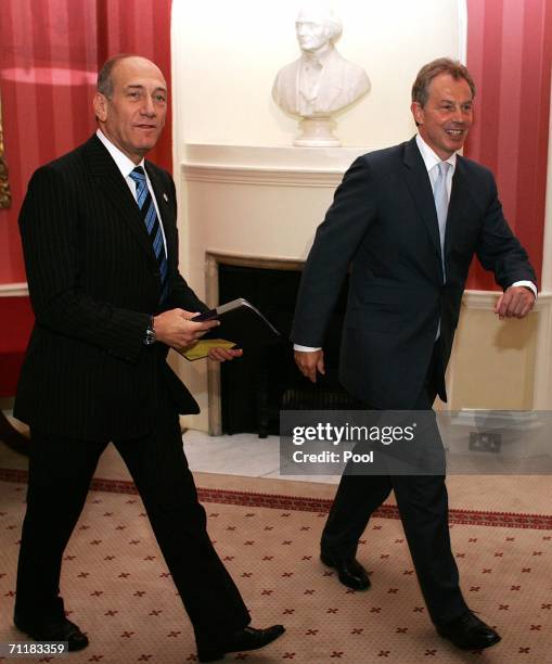 Britain's Prime Minister Tony Blair walks with Israeli Prime Minister Ehud Olmert at 10 Downing Street on June 12 in London, England.