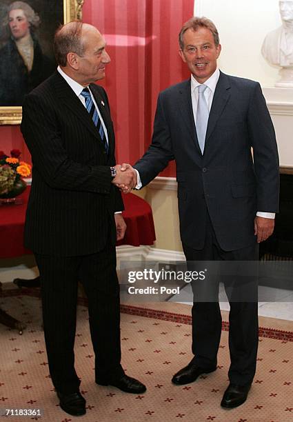 Britain's Prime Minister Tony Blair greets Israeli Prime Minister Ehud Olmert at 10 Downing Street on June 12 in London, England.