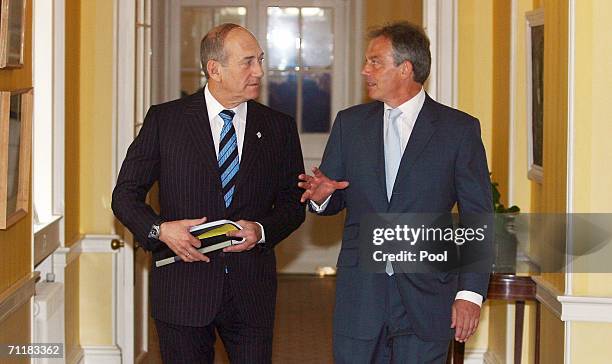 Britain's Prime Minister Tony Blair talks with Israeli Prime Minister Ehud Olmert at 10 Downing Street on June 12 in London, England.