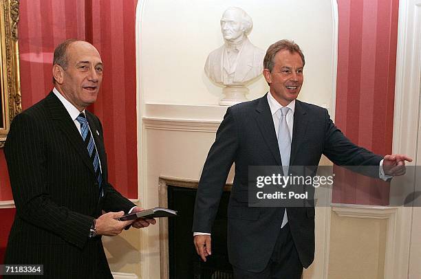 Britain's Prime Minister Tony Blair walks with Israeli Prime Minister Ehud Olmert at 10 Downing Street on June 12 in London, England.