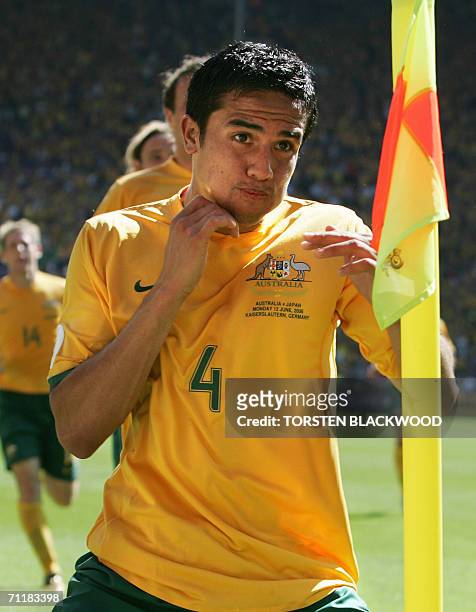 Kaiserslautern, GERMANY: Australian midfielder Tim Cahill celebrates his goal against Japan in their first round Group F World Cup football match at...