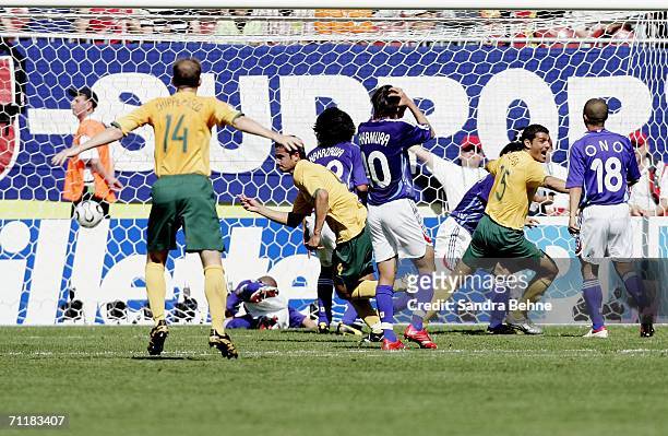 Tim Cahill of Australia, turns away and celebrates after scoring his team's first goal during the FIFA World Cup Germany 2006 Group F match between...