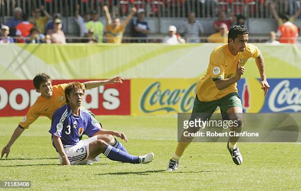 Tim Cahill of Australia celebrates after scoring his team's first goal during the FIFA World Cup Germany 2006 Group F match between Australia and...