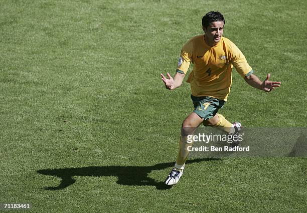 Tim Cahill of Australia celebrates after scoring his team's second goal during the FIFA World Cup Germany 2006 Group F match between Australia and...