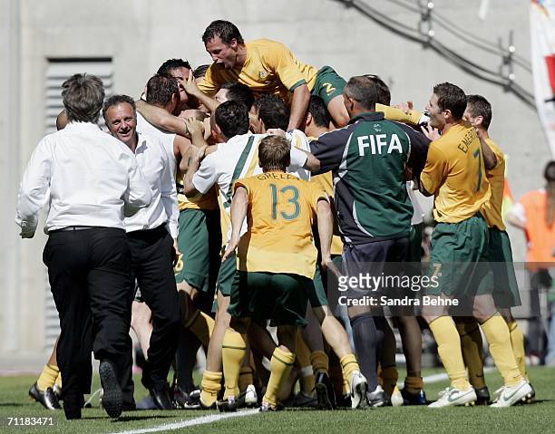 The Australian team celebrate after Tim Cahill scores their second goal during the FIFA World Cup Germany 2006 Group F match between Australia and...