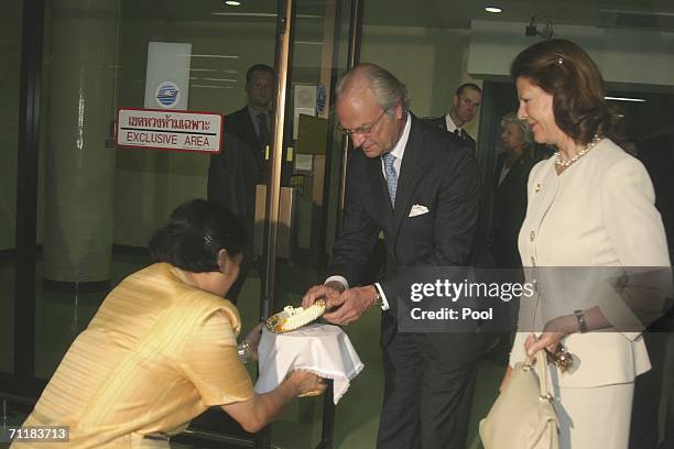 Thailand's Princess Maha Chakri Sirindhorn greets King Gustav of Sweden and Queen Silvia as they arrive at Bangkok International Airport on June 11,...