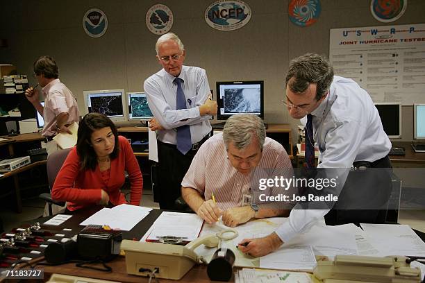 Michelle Mainelli, hurricane specialist, Max Mayfield, National Hurricane Center director, Richard Pasch, hurricane specialist, and Ed Rappaport,...