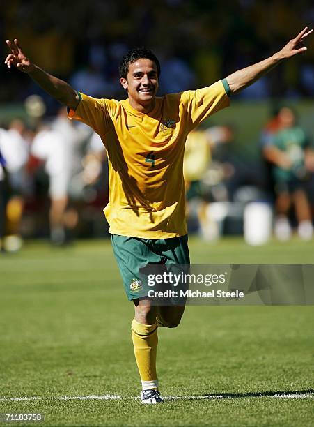 Tim Cahill of Australia raises his arms to celebrate, after scoring his team's second goal during the FIFA World Cup Germany 2006 Group F match...