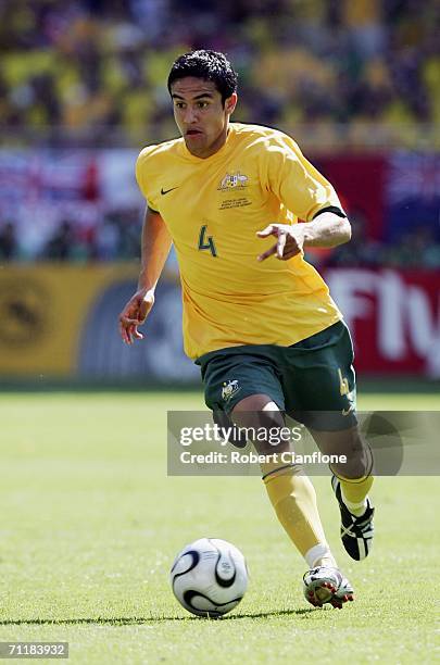 Tim Cahill of Australia runs with the ball during the FIFA World Cup Germany 2006 Group F match between Australia and Japan at the Fritz Walter...