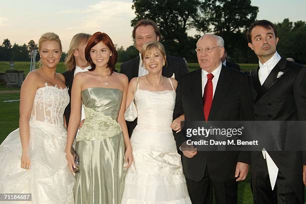 Former Russian president Mikhail Gorbachev poses with his grand-daughters Ksenia and Anastasia Virganskaya, his daughter Irina Virganskaya and...