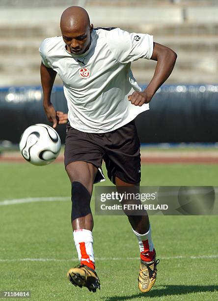 Tunisian defender Hatem Trabelsi runs during a training session at Saks Stadium in Schweinfurt, 12 June 2006. Tunisia will contest Group H of the...