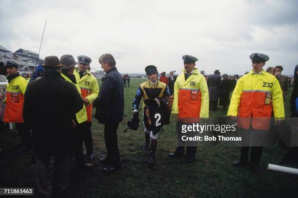 Jockey Martin Foster leaves the track after the aborted Grand National race at Aintree Racecourse, Liverpool, 3rd April 1993. The race was declared...