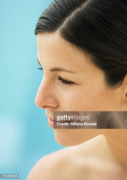 woman's face, side view - hair parting stock pictures, royalty-free photos & images
