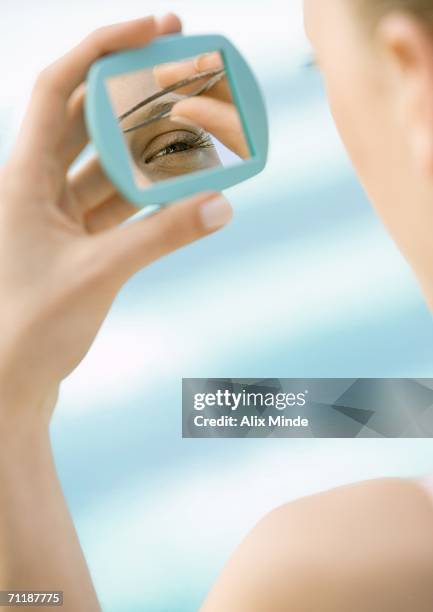 woman tweezing brows - wax stock pictures, royalty-free photos & images