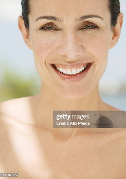 woman smiling, portrait - close up of womans neck and clavicles stock pictures, royalty-free photos & images