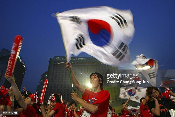 South Korean fans watch the public viewing of the FIFA World Cup Germany 2006 group G match between South Korea and Togo in front of City Hall on...