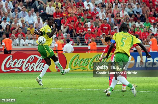 Jung-Hwan Ahn of South Korea shoots and scores the second goal for his team during the FIFA World Cup Germany 2006 Group G match between South Korea...