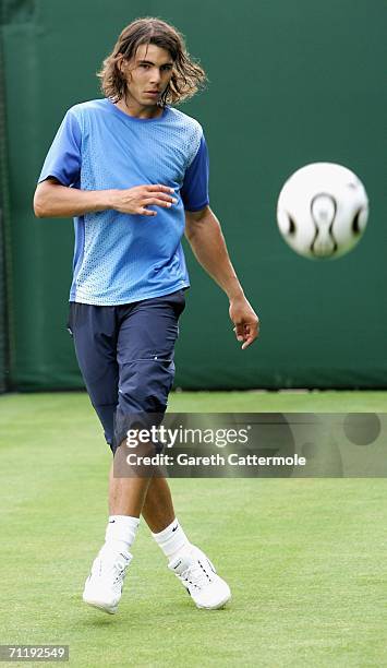 Rafael Nadal of Spain kicks a football during the Stella Artois Championships at Queen's Club on June 13, 2006 in London, Engand.