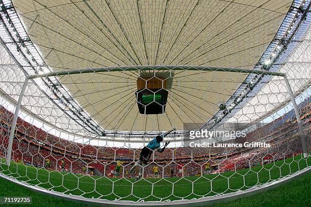 Jung-Hwan Ahn of South Korea shoots and scores the second goal for his team past Kossi Agassa of Togo during the FIFA World Cup Germany 2006 Group G...