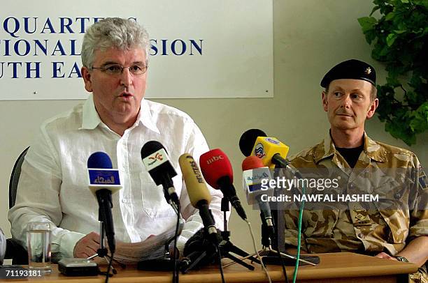 Britain's new Defence Secretary Des Browne gestures as he address journalists in the Iraqi southern city of Basra, 18 May 2006. Browne, who made a...