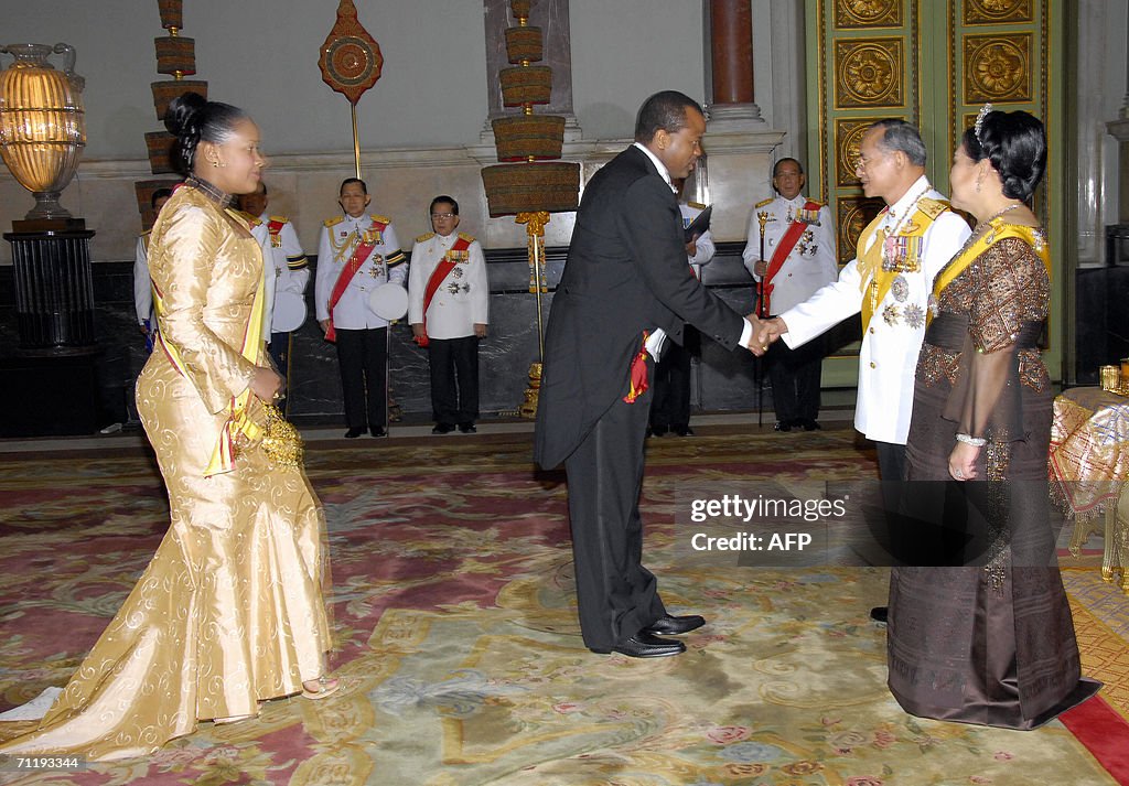 Swaziland King Mswati III (2nd L) greets