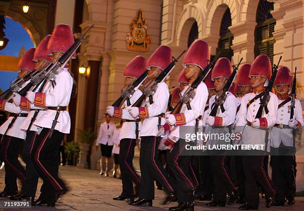Thai Royal guards wearing pink to welcome foreign monarchs, march to take position prior to the arrival of royalty at the Grand Palace in Bangkok, 13...