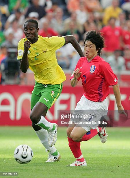 Ji-Sung Park of South Korea chases Dare Nibombe of Togo during the FIFA World Cup Germany 2006 Group G match between South Korea and Togo at the...
