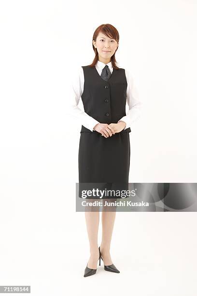 a  woman in formal attire posing - charming woman foto e immagini stock