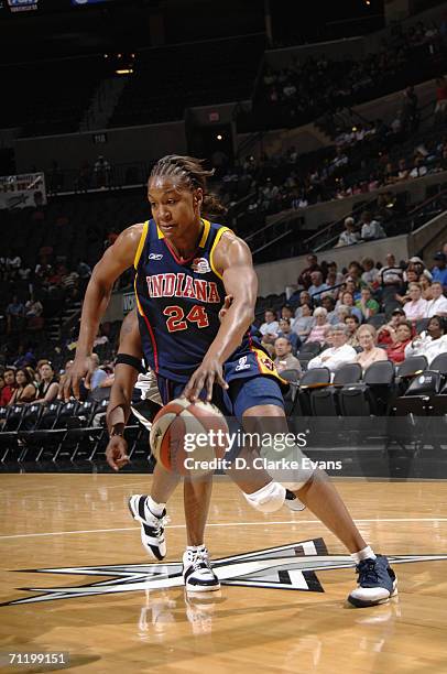 Tamika Catchings of the Indiana Fever drives during a game against the San Antonio Silver Stars at AT&T Center on May 23, 2006 in San Antonio, Texas....